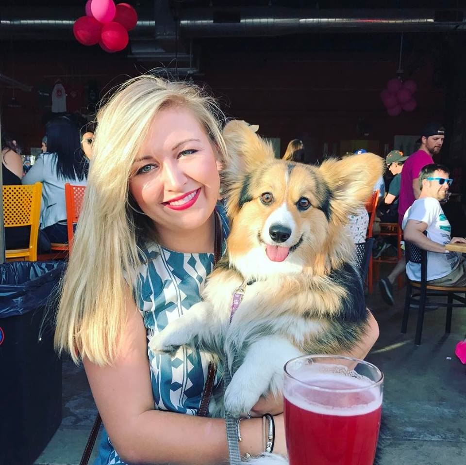 Sarah Donovan Headshot with a super cute dog.